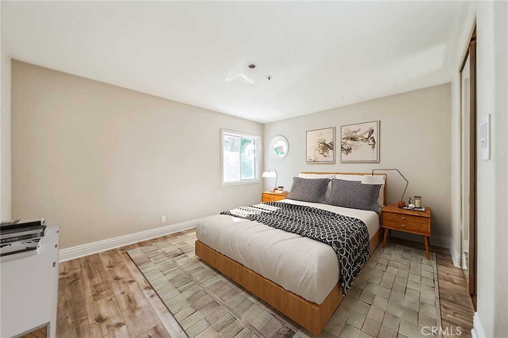 1432 Rutherford Drive Pasadena, CA 91103 - Photo 12 of 33 a bedroom with a bed and a couch