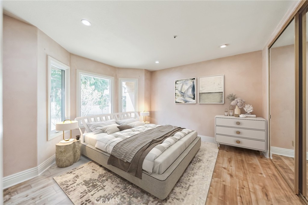 1432 Rutherford Drive Pasadena, CA 91103 - Photo 14 of 33 a bedroom with a bed and wooden floor