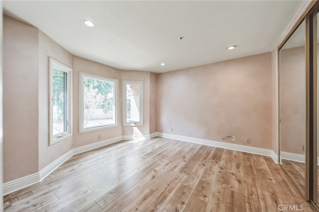 1432 Rutherford Drive Pasadena, CA 91103 - Photo 15 of 33 wooden floor in an empty room with a window