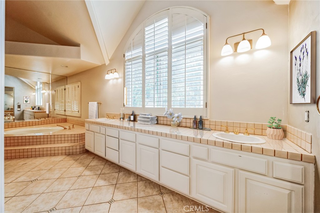1432 Rutherford Drive Pasadena, CA 91103 - Photo 18 of 33 a large white bathroom with a large window sink and vanity