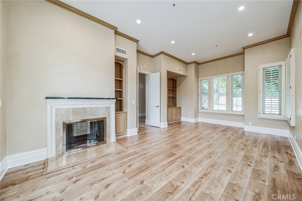 1432 Rutherford Drive Pasadena, CA 91103 - Photo 20 of 33 a view of an empty room with a fireplace and a window