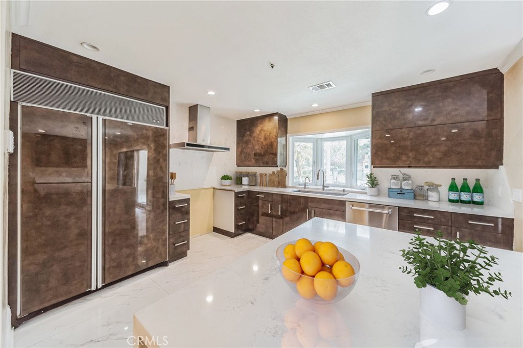 1432 Rutherford Drive Pasadena, CA 91103 - Photo 2 of 33 a kitchen with stainless steel appliances wooden floor and a refrigerator