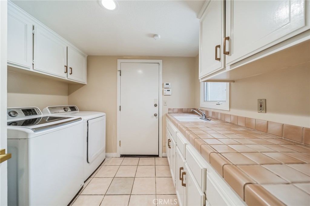 1432 Rutherford Drive Pasadena, CA 91103 - Photo 24 of 33 a kitchen with a stove cabinets and a sink