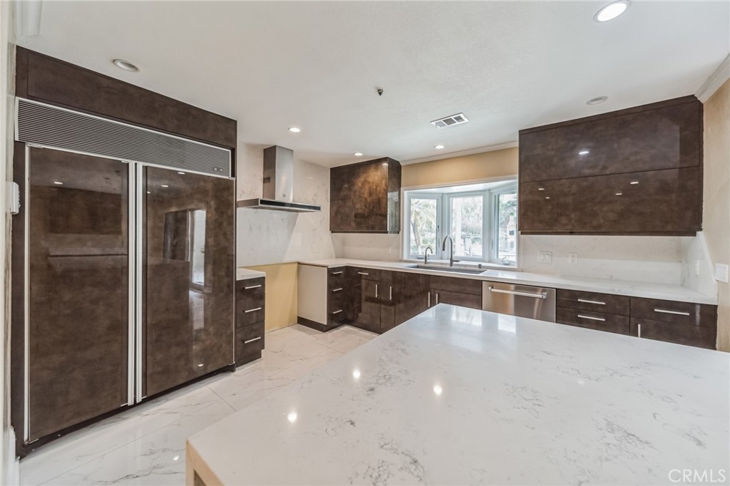 1432 Rutherford Drive Pasadena, CA 91103 - Photo 3 of 33 a kitchen with stainless steel appliances a refrigerator and a counter top