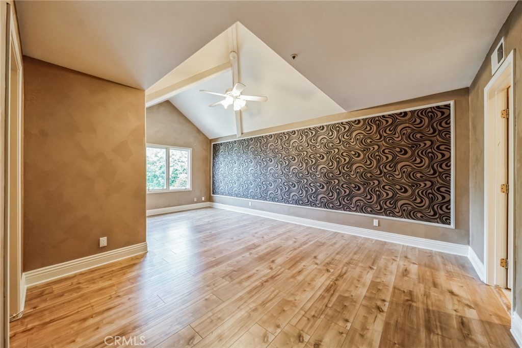 1432 Rutherford Drive Pasadena, CA 91103 - Photo 31 of 33 a view of an empty room with wooden floor and a window