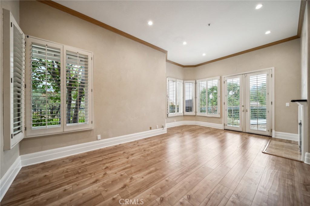 1432 Rutherford Drive Pasadena, CA 91103 - Photo 5 of 33 a view of empty room with wooden floor and fan