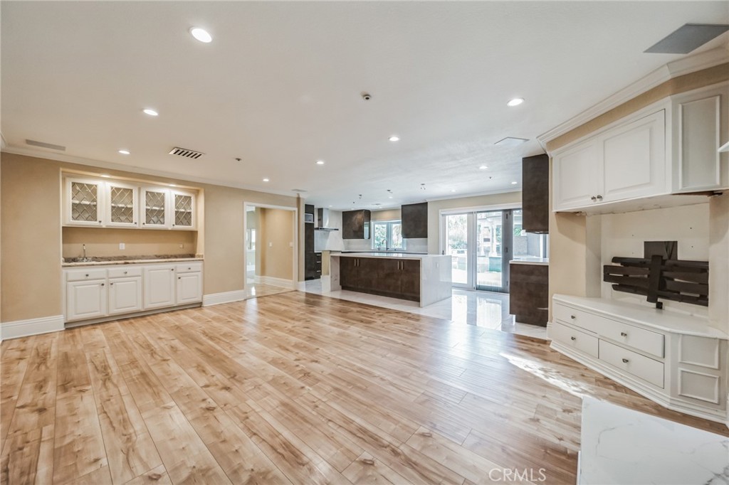 1432 Rutherford Drive Pasadena, CA 91103 - Photo 7 of 33 a view of a kitchen with a sink oven cabinets and wooden floor