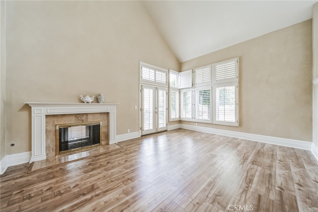 1432 Rutherford Drive Pasadena, CA 91103 - Photo 9 of 33 wooden floor fireplace and windows in a room
