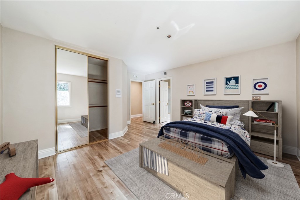 1432 Rutherford Drive Pasadena, CA 91103 - Photo 10 of 33 a bedroom with furniture and a wooden floor