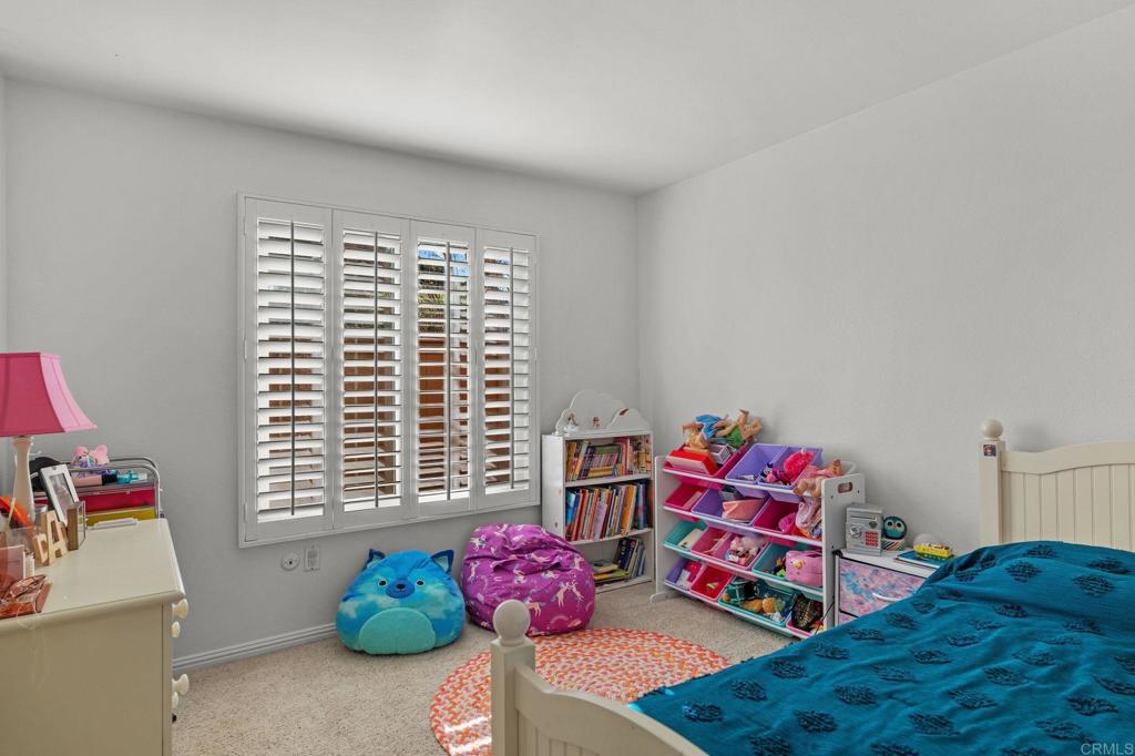 3402 Summer Set Way Oceanside, CA 92056 - Photo 22 of 24 a bedroom with furniture and a window