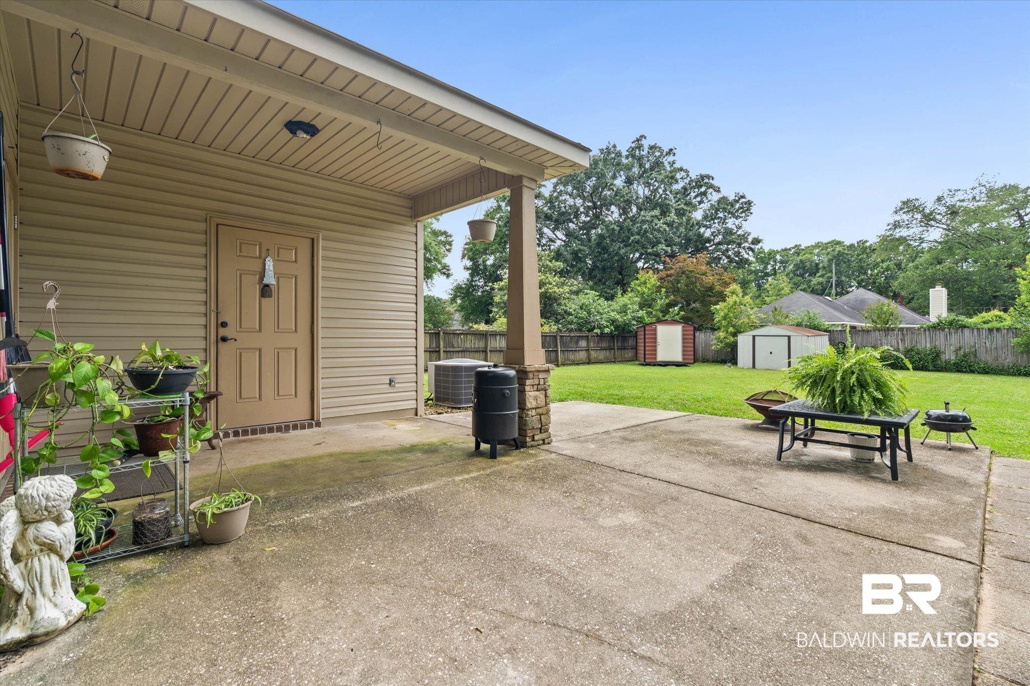 800 Galoway Avenue Mobile, AL 36609 - Photo 18 of 22 Covered patio with a concrete slab and a stone-clad pillar