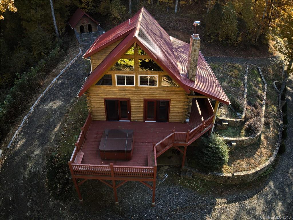 a aerial view of a house with a yard
