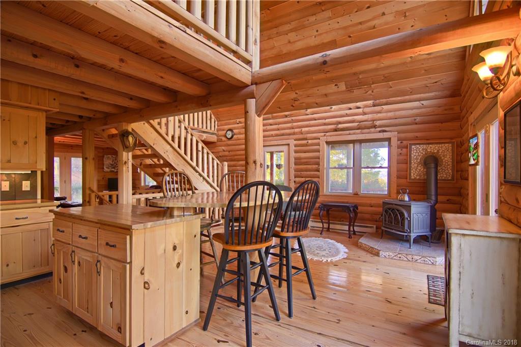 548 Miller Branch Road Mars Hill, NC 28754 - Photo 13 of 35 a view of a livingroom with furniture wooden floor and windows