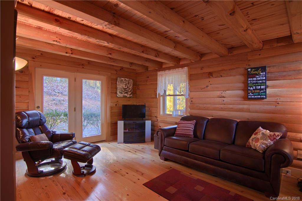 548 Miller Branch Road Mars Hill, NC 28754 - Photo 14 of 35 a living room with furniture and a fireplace