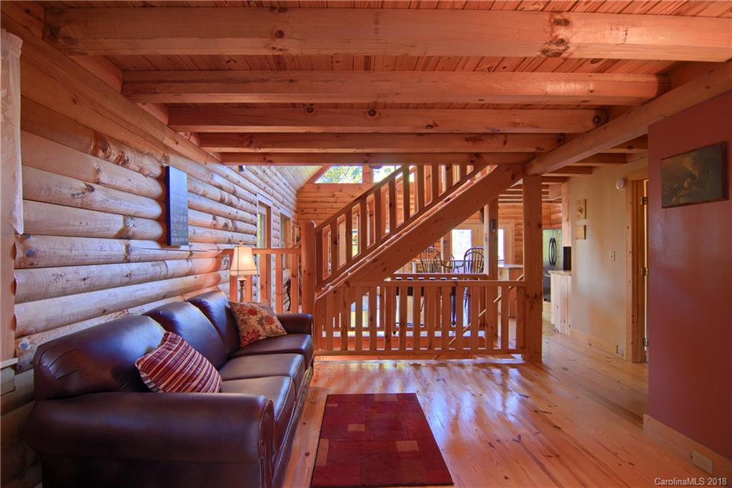 548 Miller Branch Road Mars Hill, NC 28754 - Photo 15 of 35 a living room with furniture and a rug