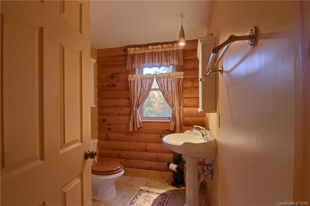 548 Miller Branch Road Mars Hill, NC 28754 - Photo 17 of 35 a bathroom with a sink toilet and shower
