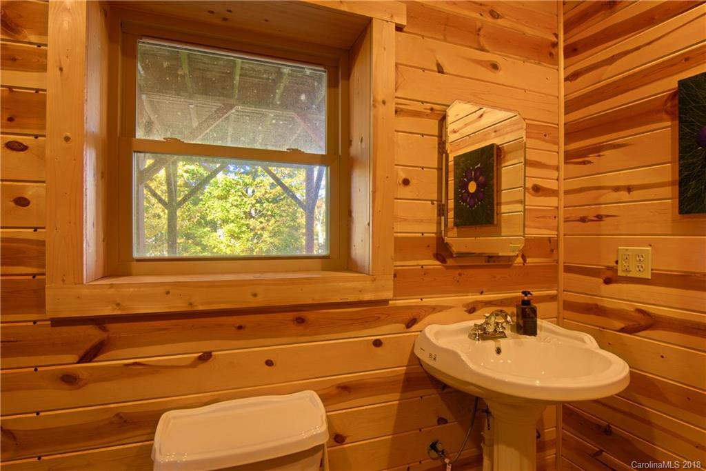 548 Miller Branch Road Mars Hill, NC 28754 - Photo 21 of 35 a bathroom with a sink and a mirror
