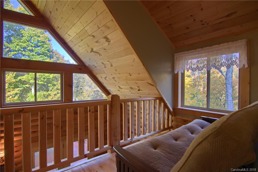548 Miller Branch Road Mars Hill, NC 28754 - Photo 23 of 35 a living room with furniture and a large window
