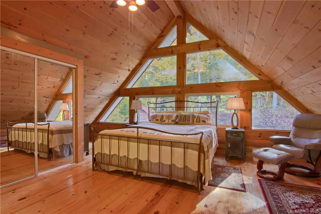 548 Miller Branch Road Mars Hill, NC 28754 - Photo 26 of 35 a bedroom with furniture and a window