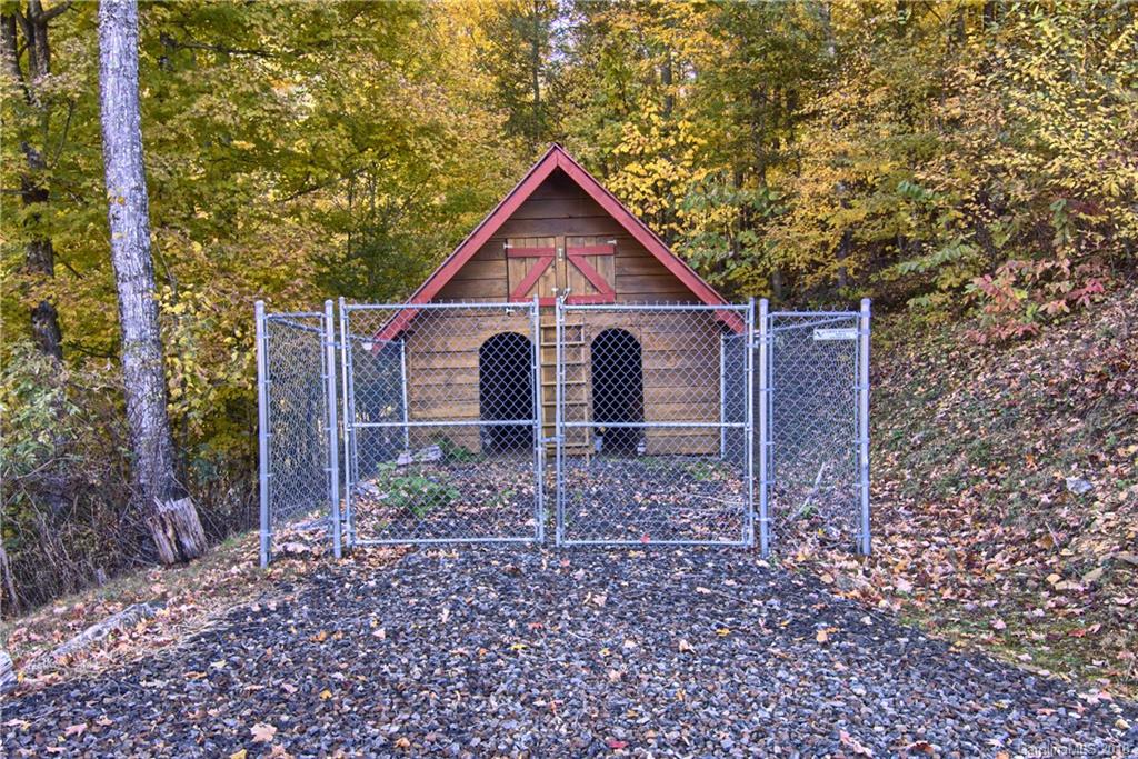 548 Miller Branch Road Mars Hill, NC 28754 - Photo 32 of 35 a view of barn with a small yard and large trees