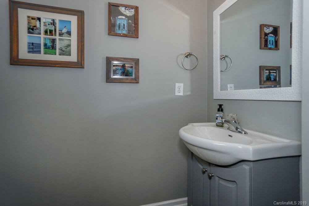 10029 Caldwell Depot Road Cornelius, NC 28031 - Photo 18 of 34 a bathroom with a sink and a mirror