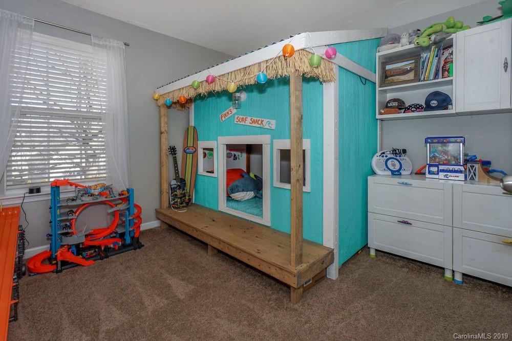 10029 Caldwell Depot Road Cornelius, NC 28031 - Photo 28 of 34 a children room with toys and a window