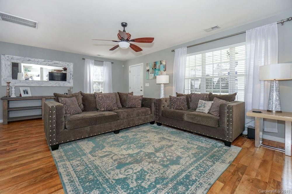 10029 Caldwell Depot Road Cornelius, NC 28031 - Photo 4 of 34 a living room with furniture and a large window