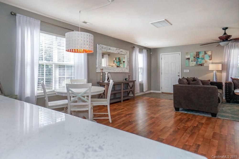 10029 Caldwell Depot Road Cornelius, NC 28031 - Photo 10 of 34 a living room with furniture and a wooden floor