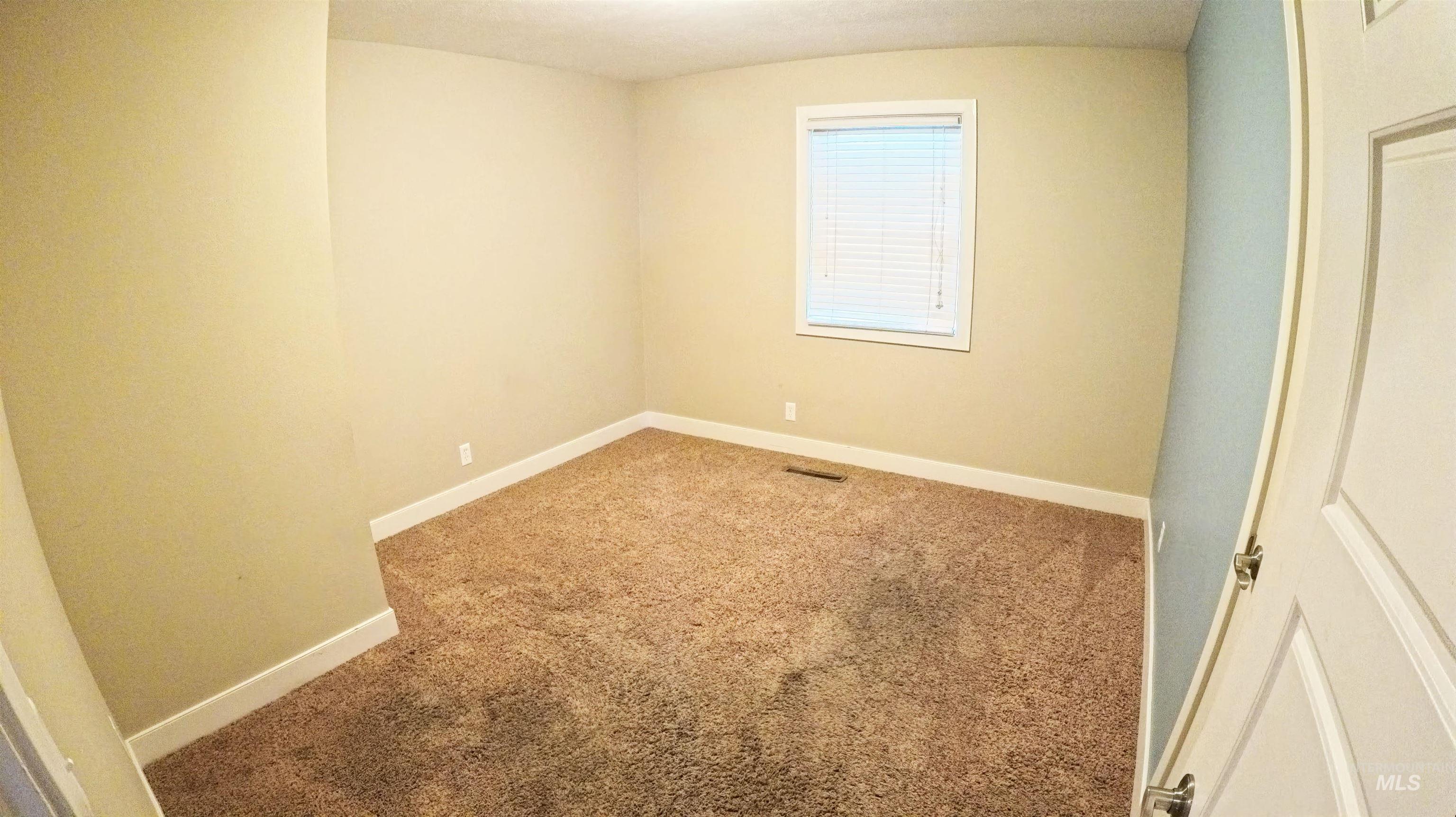 223 Hillcrest Road Burley, ID 83318 - Photo 13 of 27 Unfurnished bedroom with baseboards and carpet flooring
