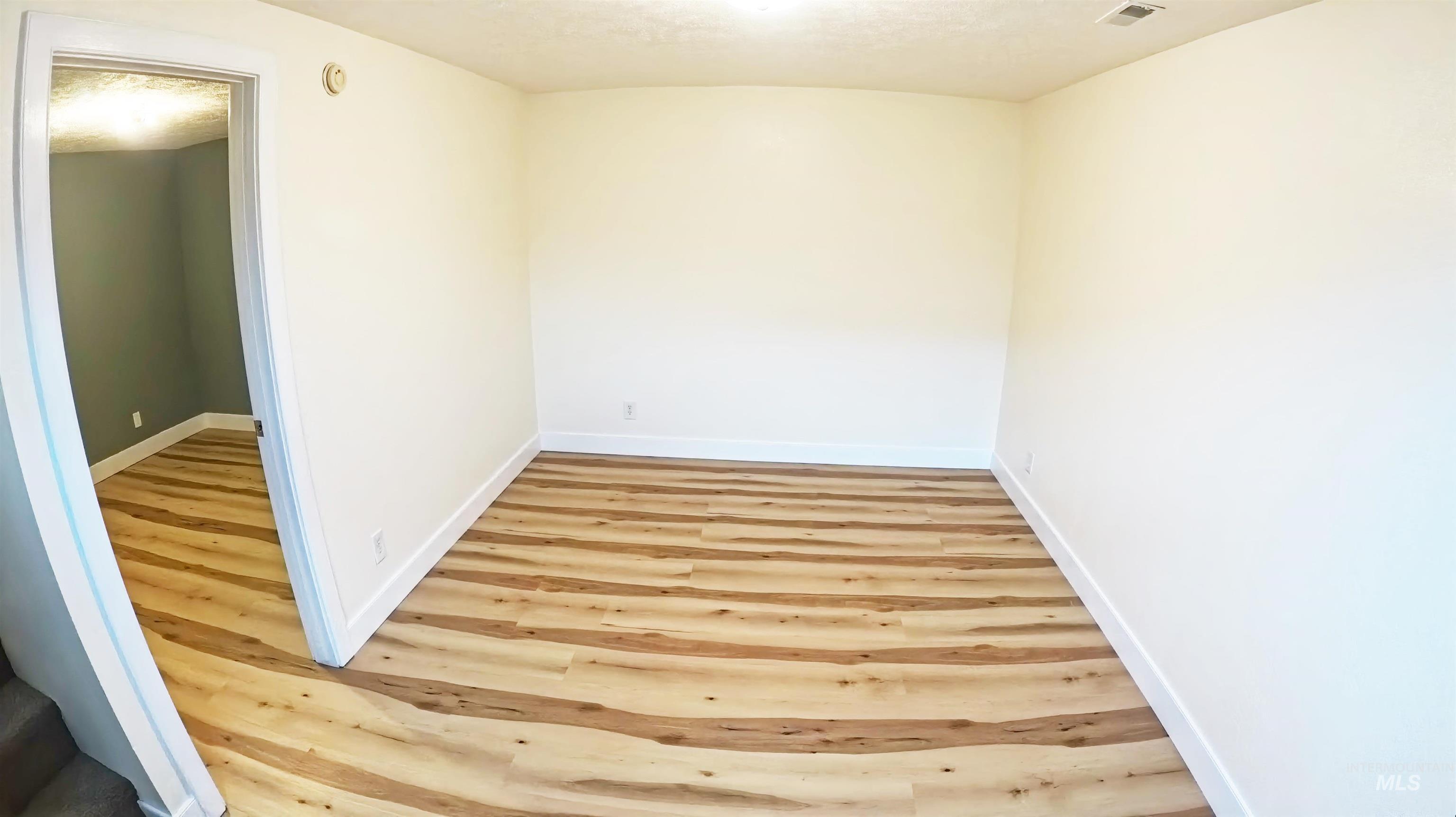 223 Hillcrest Road Burley, ID 83318 - Photo 17 of 27 Spare room featuring light wood-style flooring and baseboards