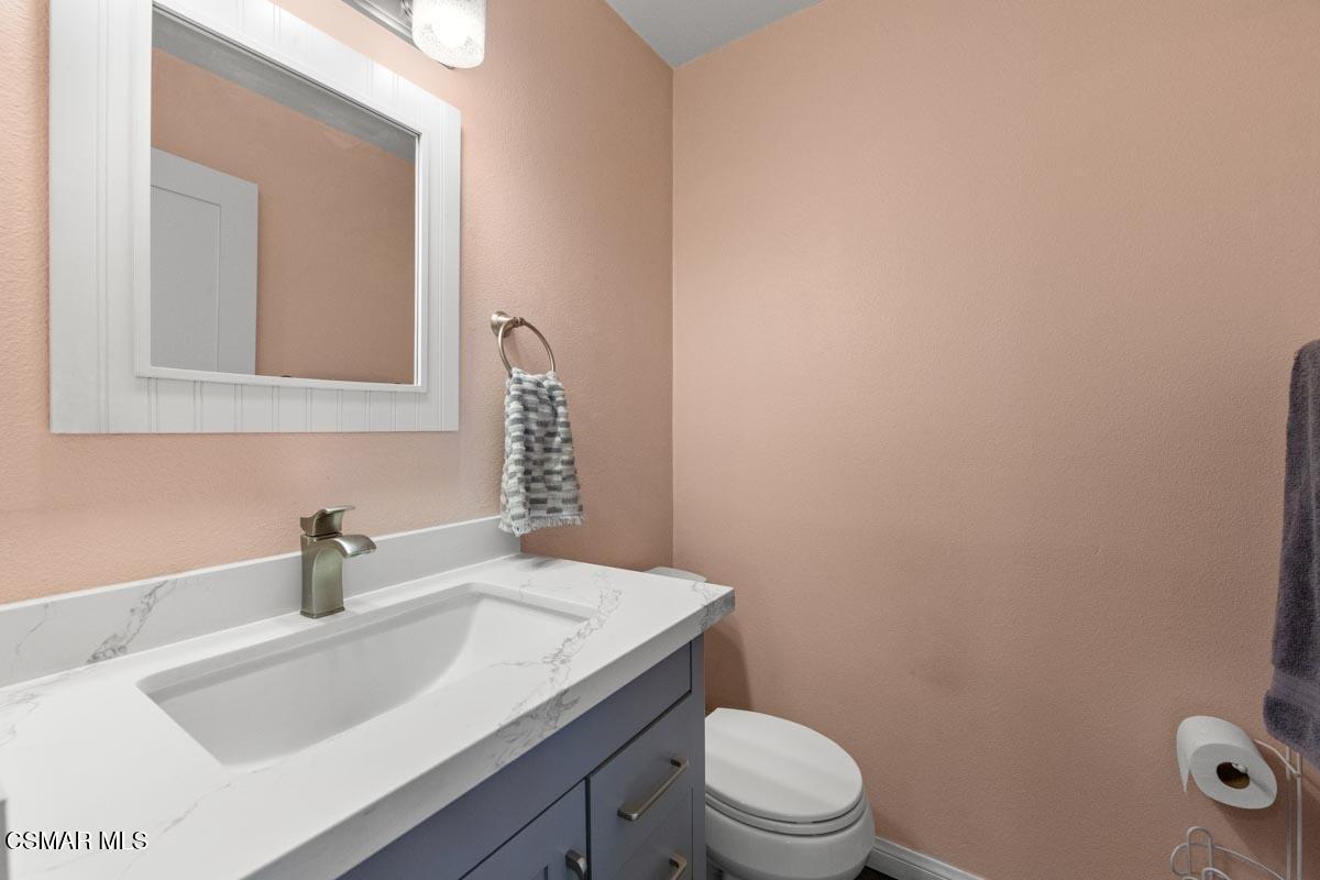 3918 Cochran Street, Unit 19 Simi Valley, CA 93063 - Photo 8 of 22 a bathroom with a sink a toilet and mirror
