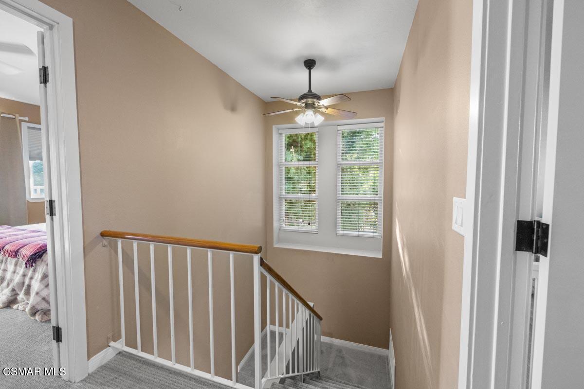 3918 Cochran Street, Unit 19 Simi Valley, CA 93063 - Photo 9 of 22 a view of a hallway with windows and stairs