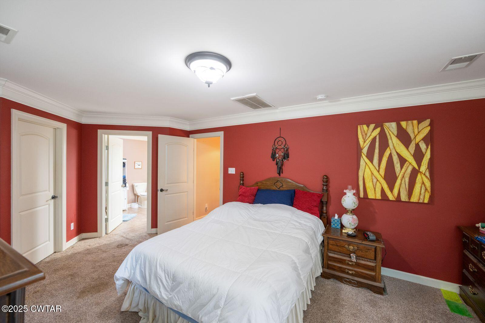 2400 Sand Ridge Bargerton Road Lexington, TN 38351 - Photo 22 of 48 a bedroom with a bed and a window