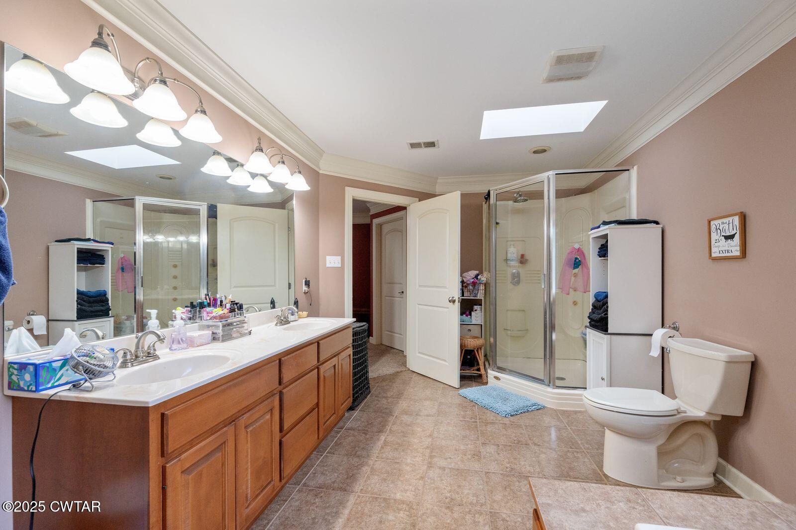 2400 Sand Ridge Bargerton Road Lexington, TN 38351 - Photo 23 of 48 a bathroom with a sink vanity mirror and toilet