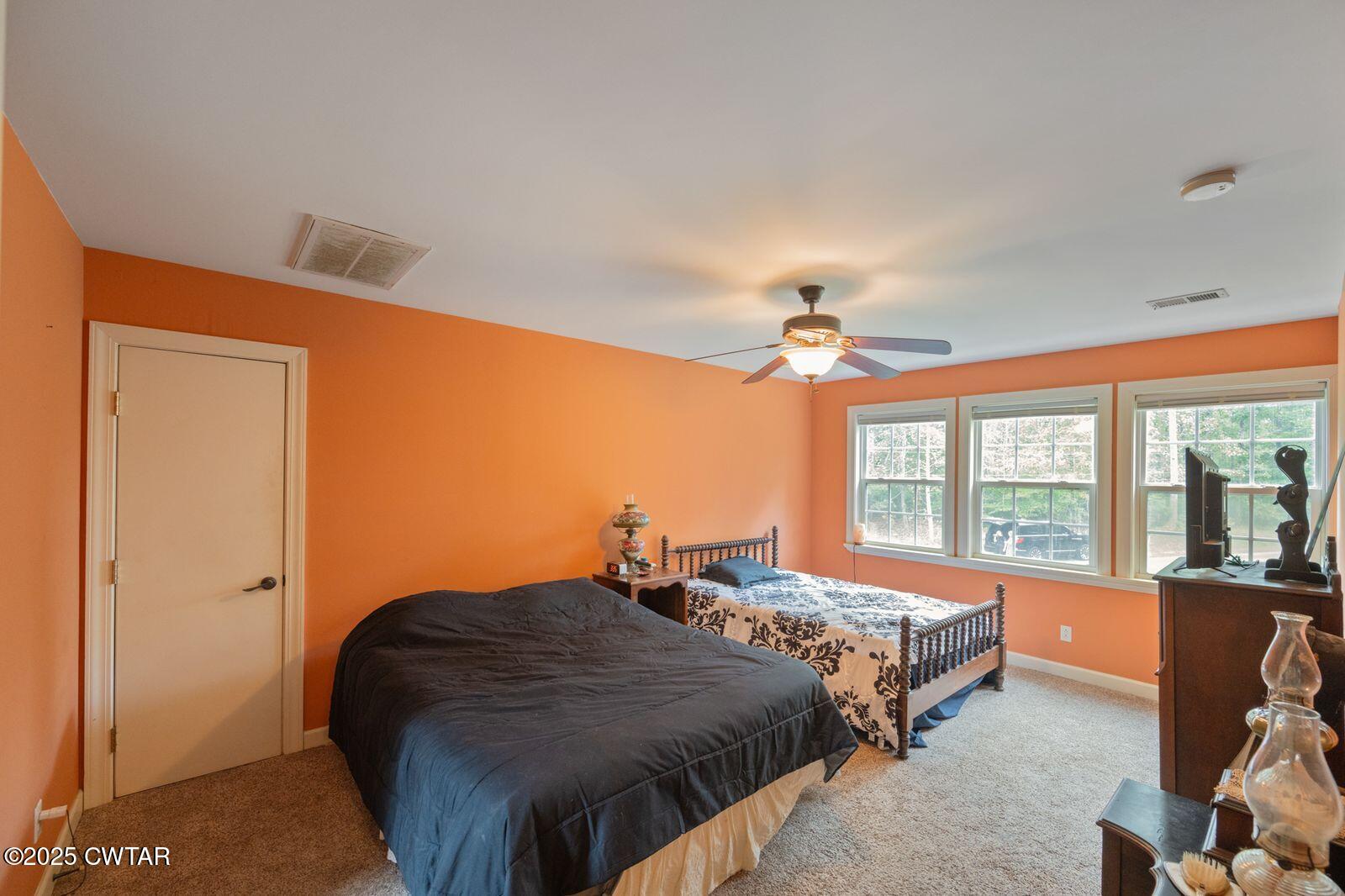 2400 Sand Ridge Bargerton Road Lexington, TN 38351 - Photo 24 of 48 a bedroom with double bed and a large window