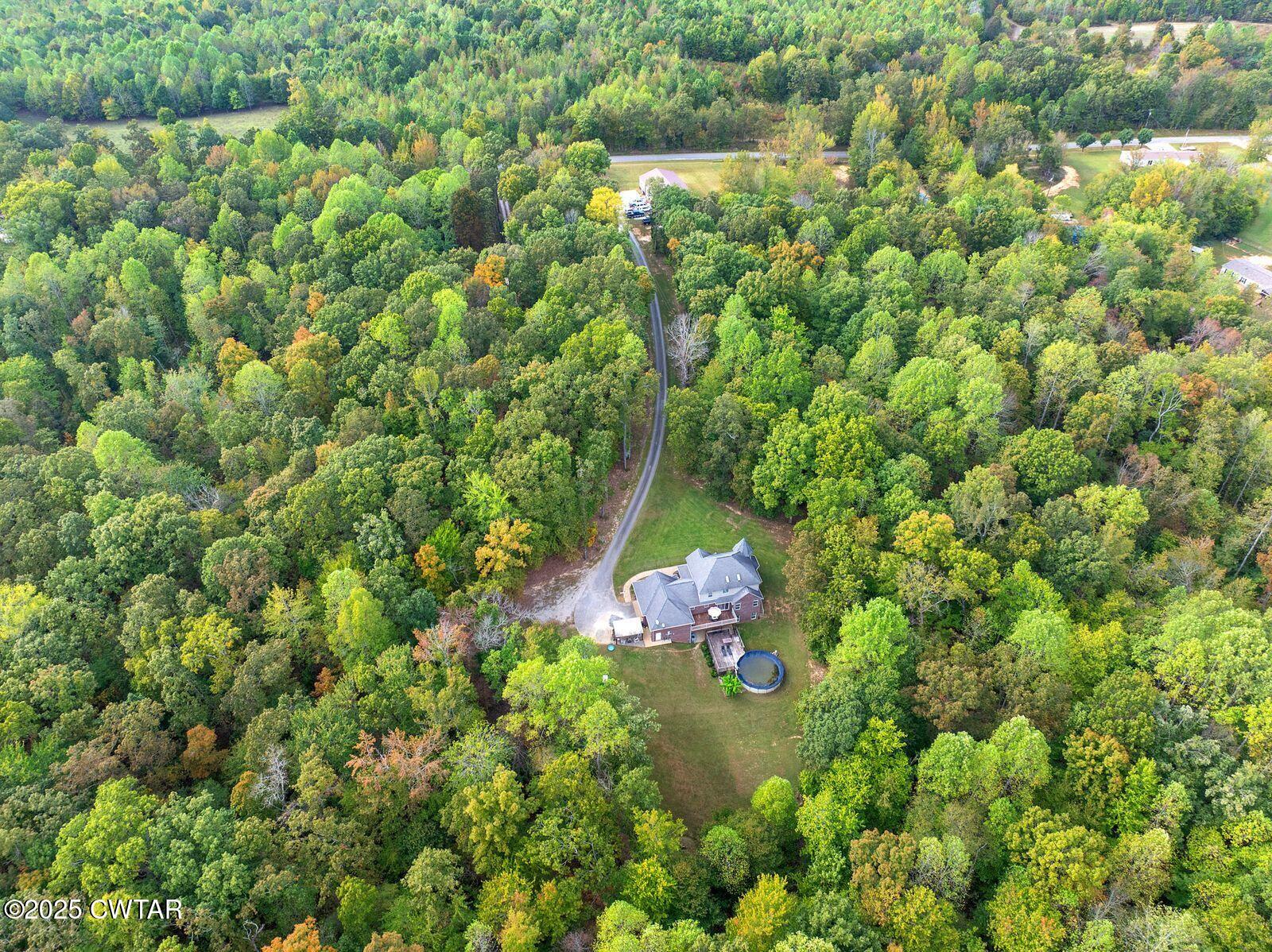 2400 Sand Ridge Bargerton Road Lexington, TN 38351 - Photo 46 of 48 a backyard of a house with lots of green space and garden