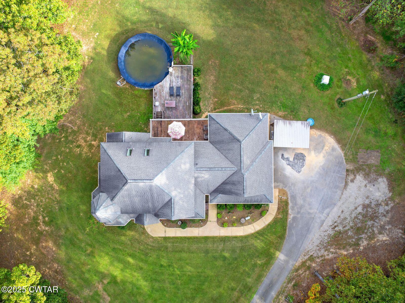 2400 Sand Ridge Bargerton Road Lexington, TN 38351 - Photo 47 of 48 a view of a house with a yard and sitting area