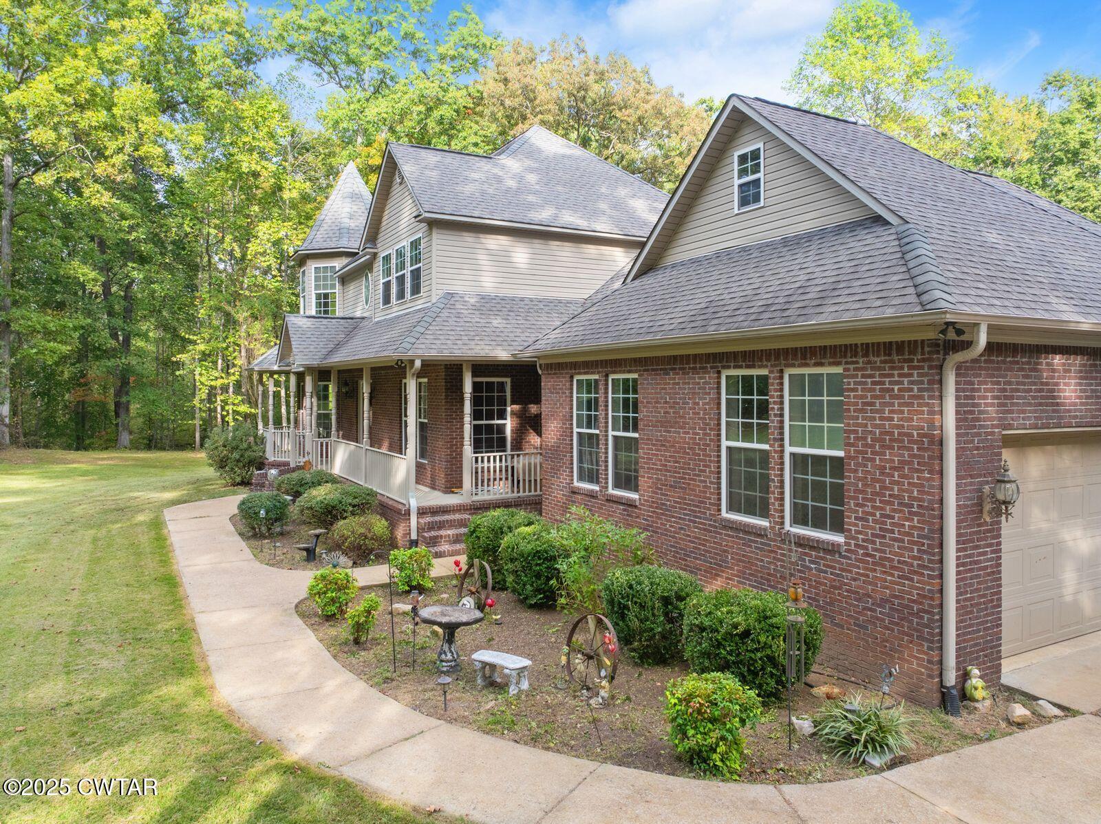 2400 Sand Ridge Bargerton Road Lexington, TN 38351 - Photo 48 of 48 a front view of a house with garden