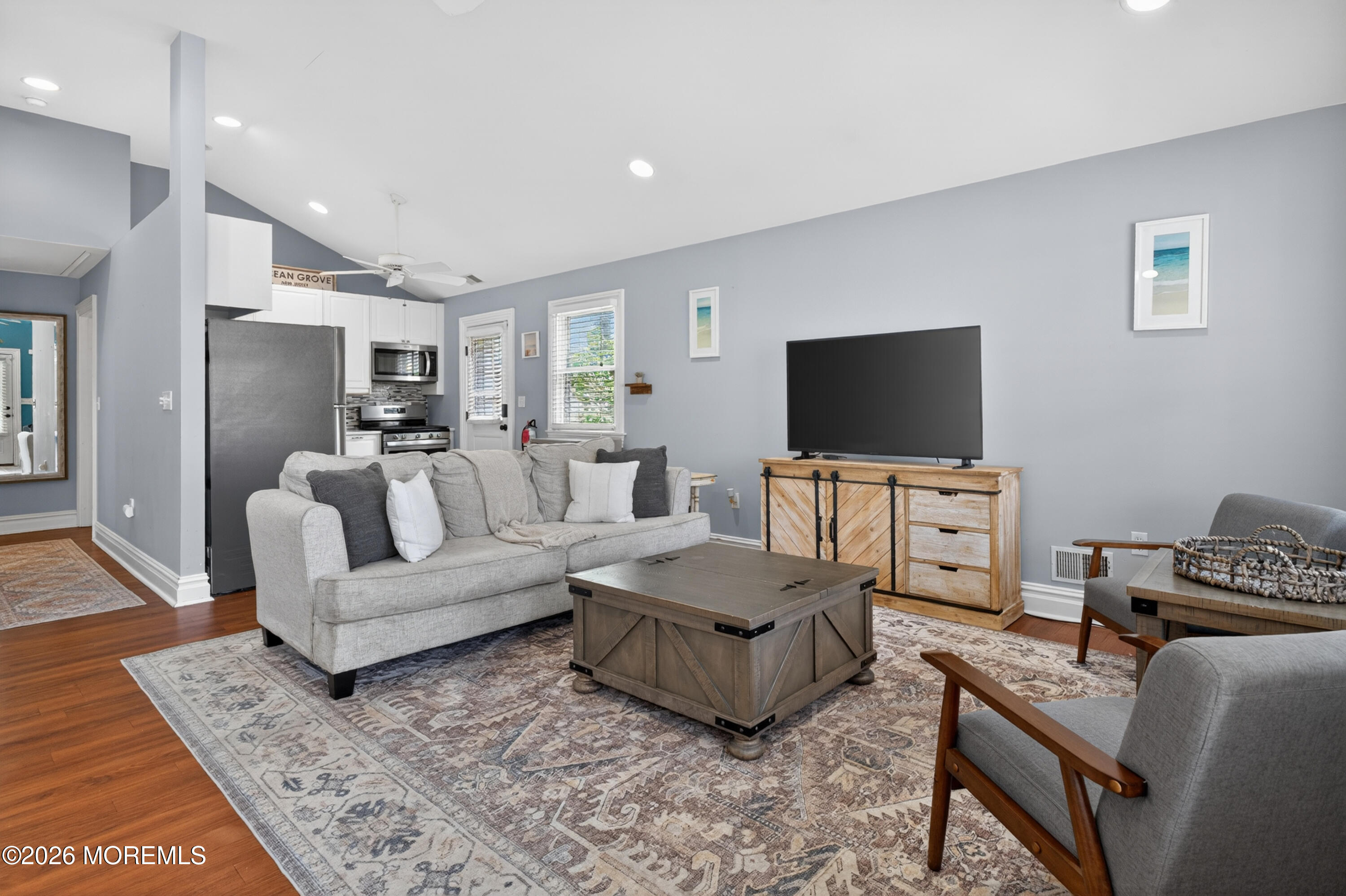 65 Heck Avenue Ocean Grove, NJ 07756 - Photo 7 of 37 a living room with furniture and a flat screen tv