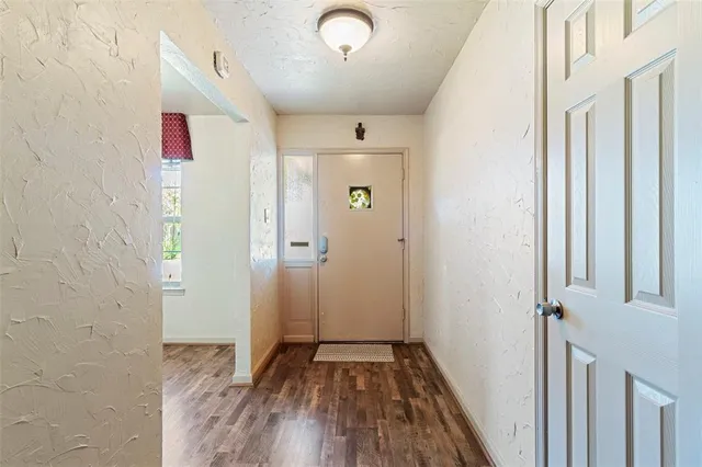 a view of entryway with wooden floor