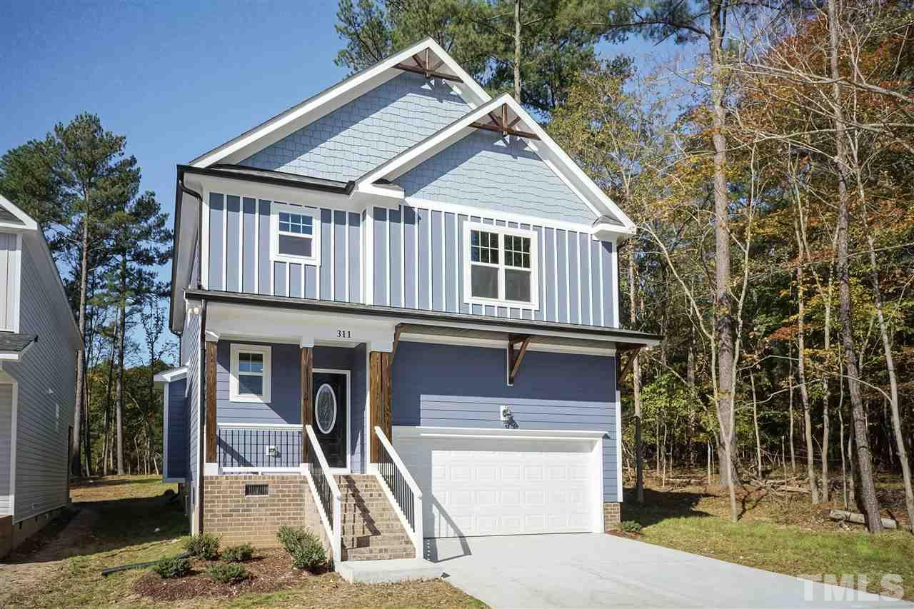 3430 Dutchman Road Raleigh, NC 27610 - Photo 1 of 21 a front view of a house with a yard