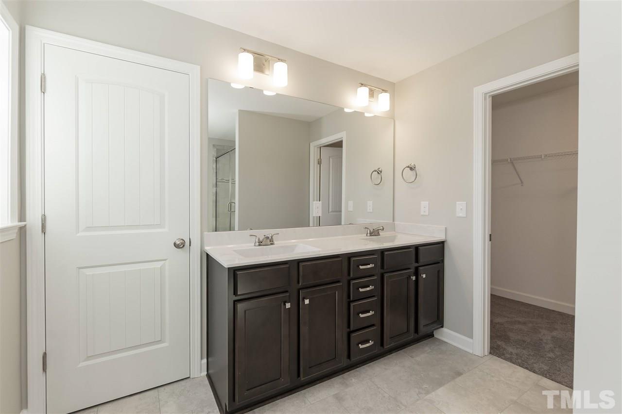 3430 Dutchman Road Raleigh, NC 27610 - Photo 12 of 21 a spacious bathroom with a double vanity sink and a mirror