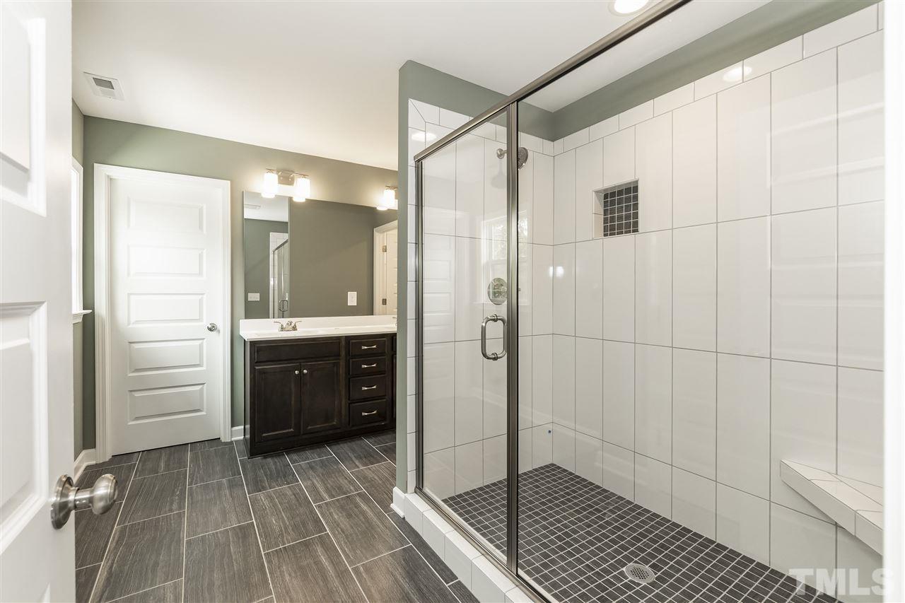 3430 Dutchman Road Raleigh, NC 27610 - Photo 16 of 21 a bathroom with a shower and a sink