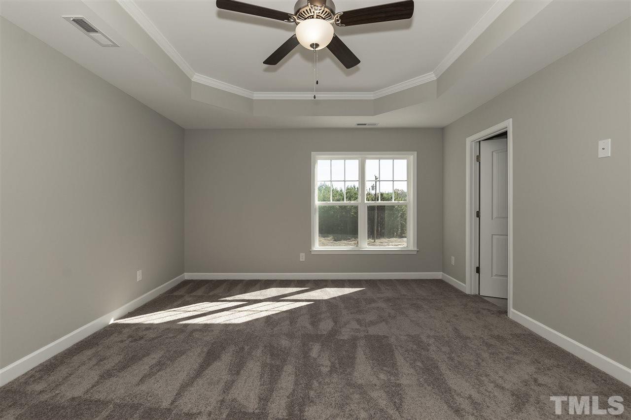 3430 Dutchman Road Raleigh, NC 27610 - Photo 10 of 21 a view of room with window and ceiling fan