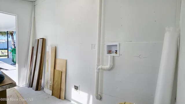 a view of swimming pool with a couch and table in the balcony