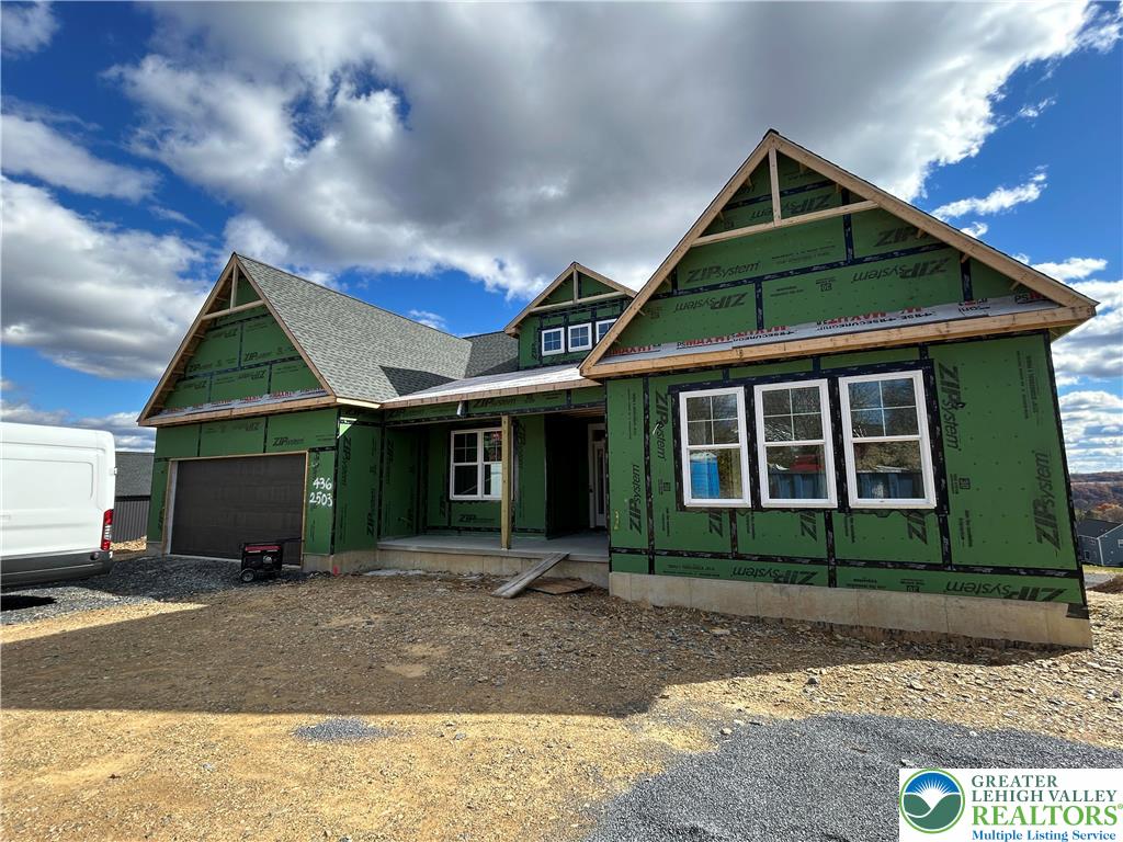 436 Willow Road, Unit LOT 15 Walnutport, PA 18088 - Photo 3 of 8 a front view of a house with a yard and garage