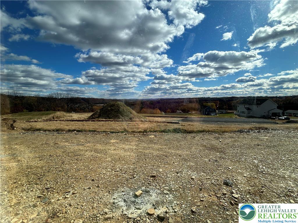 436 Willow Road, Unit LOT 15 Walnutport, PA 18088 - Photo 7 of 8 a view of swimming pool with a yard in back