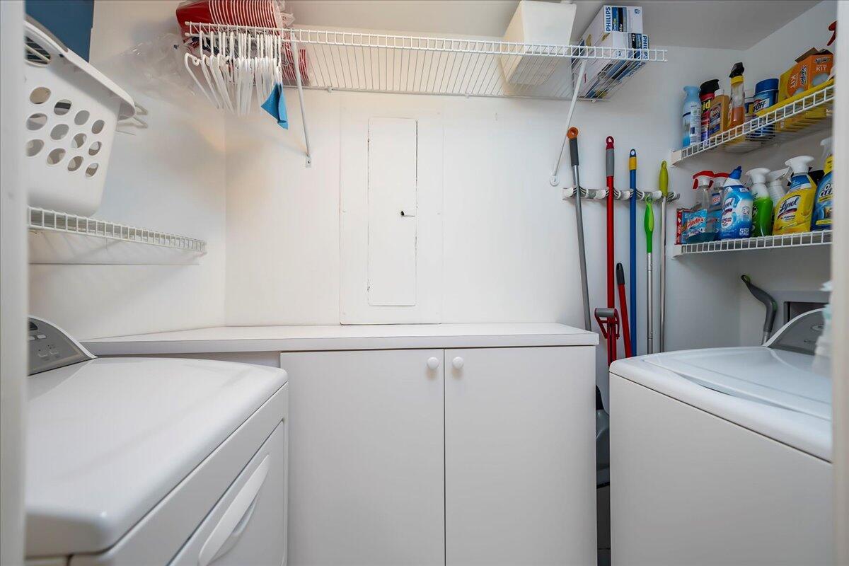 4201 North Ocean Boulevard, Unit 203 Boca Raton, FL 33431 - Photo 12 of 54 a view of storage and utility room with washer and dryer
