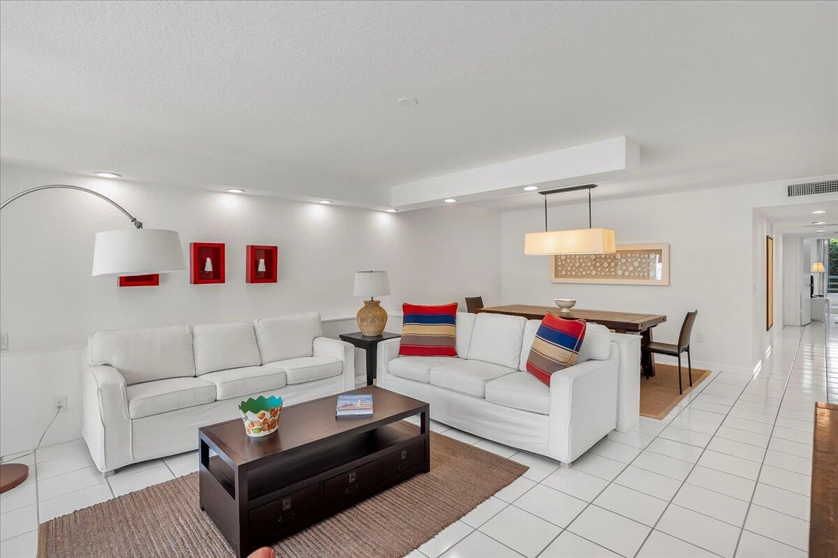 4201 North Ocean Boulevard, Unit 203 Boca Raton, FL 33431 - Photo 24 of 54 a living room with furniture and a couch