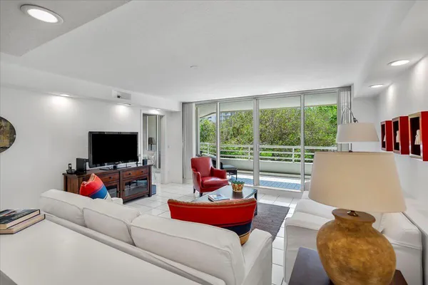 a view of living room with furniture and a window